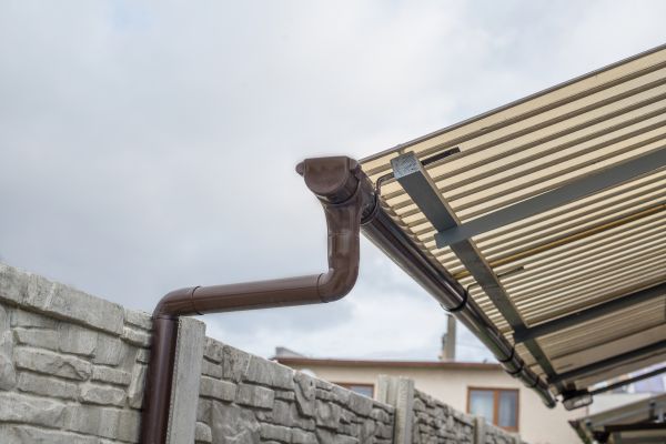 Plastic Downspout Installation in Carthage